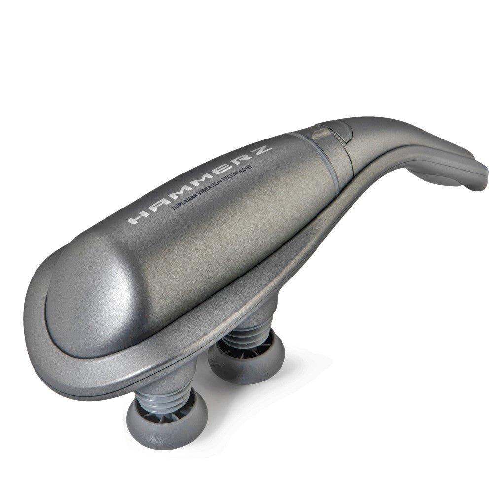 HAMMERZ MASSAGE DEVICE WITH TRIPLANAR VIBRATION TECHNOLOGY — Silver Hammerz massager lying on its side